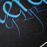 calligraphy-art-blue-silver-close-up