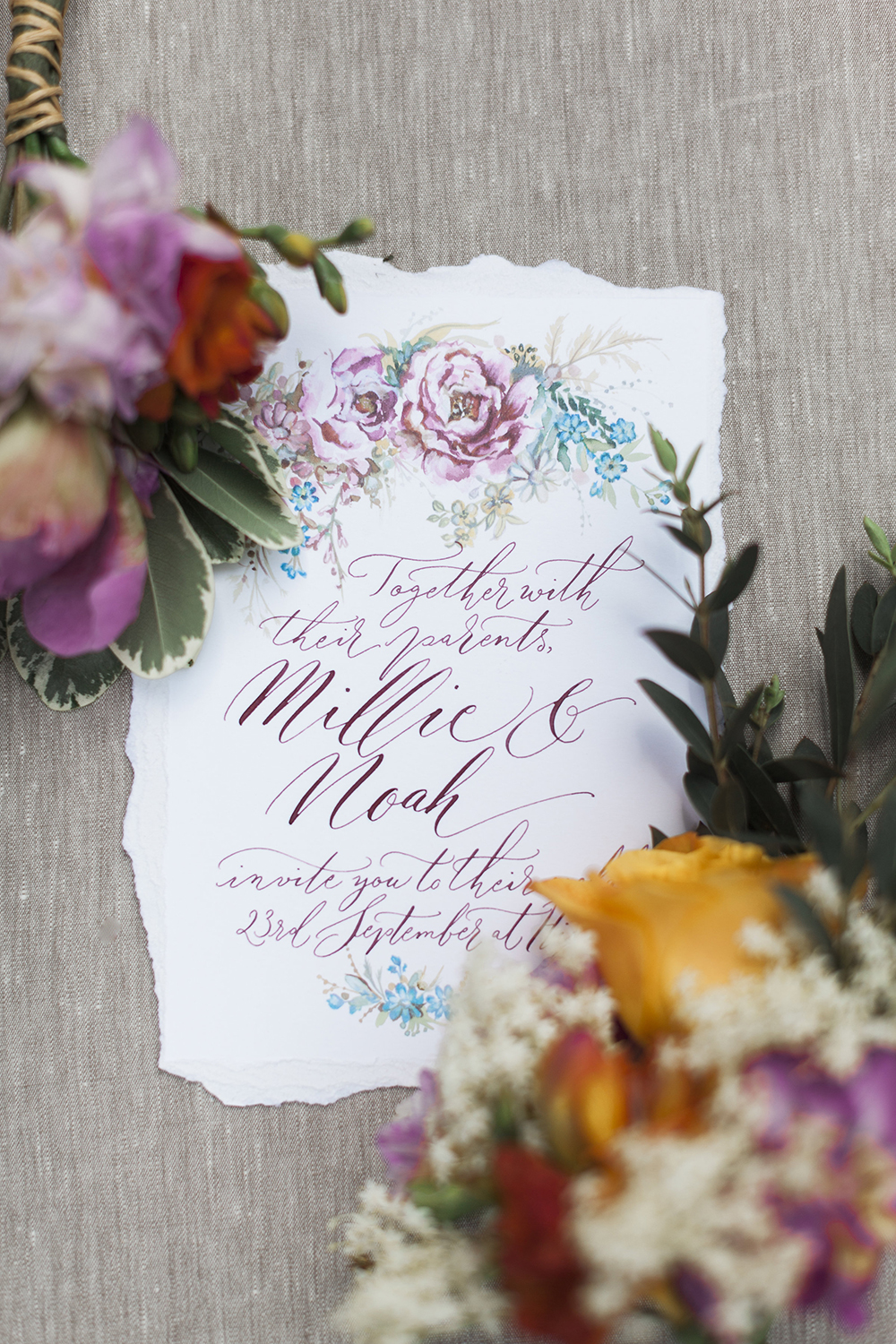 Handwritten calligraphy wedding invitation with illustration