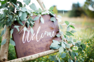 Varnished wood wedding welcome sign in modern calligraphy