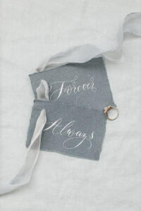 Torn edge blue grey cotton rag tags with custom calligraphy wording for wedding styling