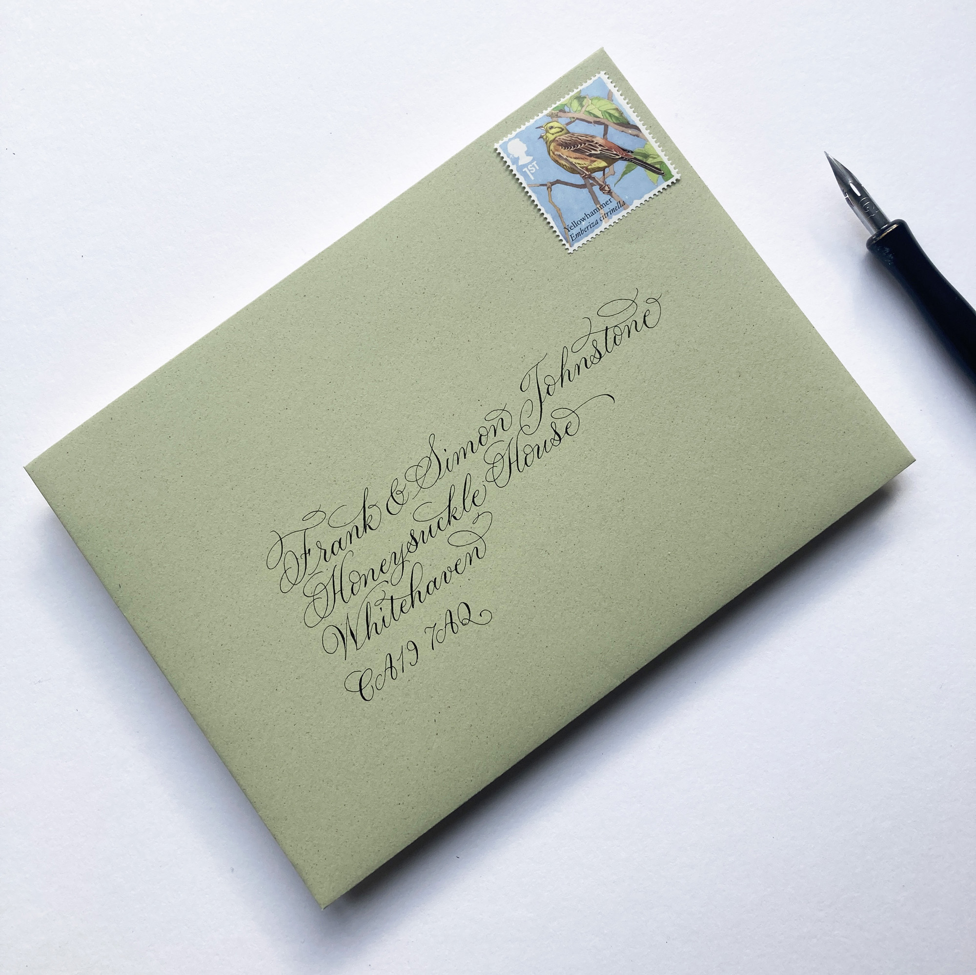 Flourished calligraphy writing for wedding invitation envelopes