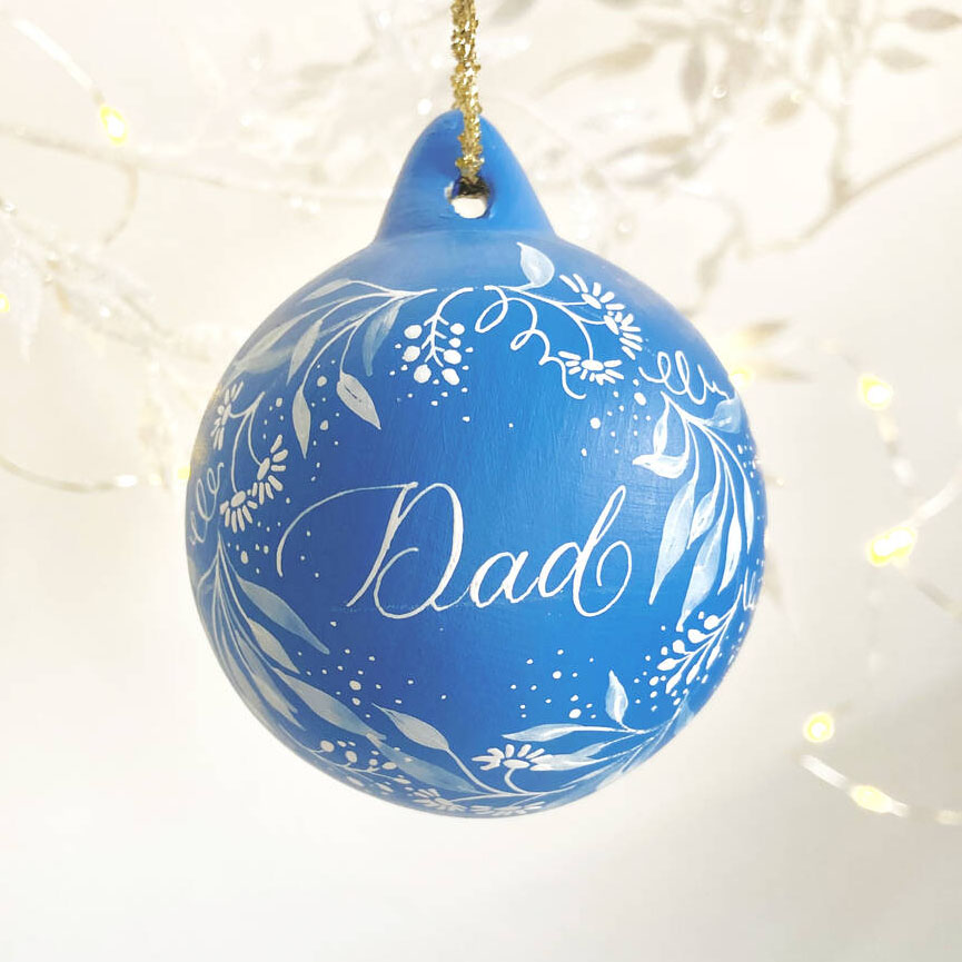 personalised Christmas name bauble made in the UK with calligraphy