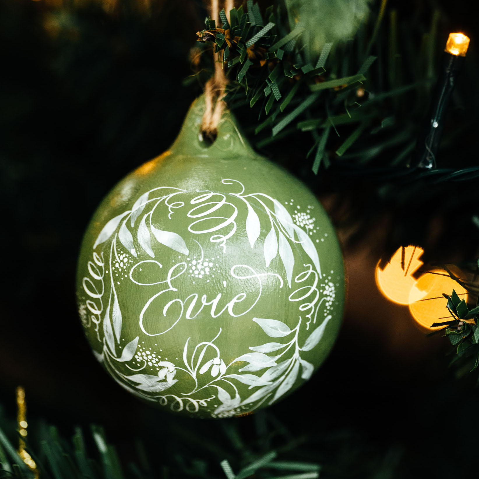 personalised Christmas name bauble made in the UK with calligraphy