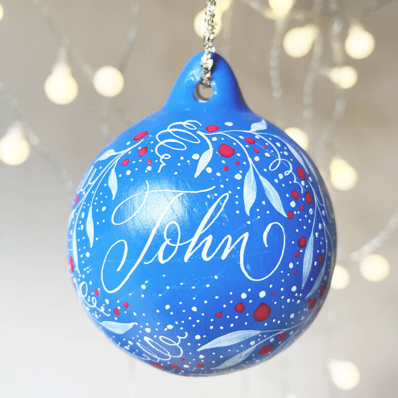 personalised Christmas name bauble made in the UK with calligraphy