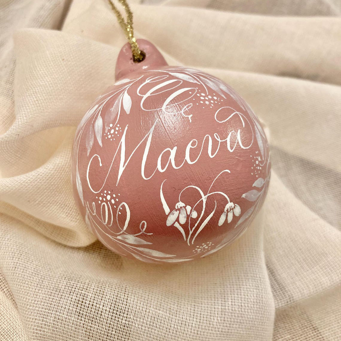 personalised Christmas name bauble made in the UK with calligraphy