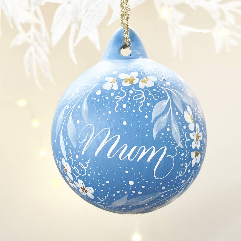 personalised Christmas name bauble made in the UK with calligraphy