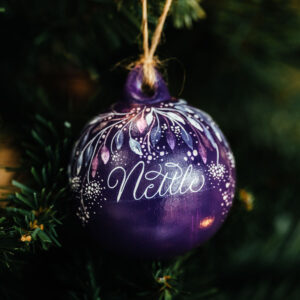 purple Christmas bauble with name in calligraphy