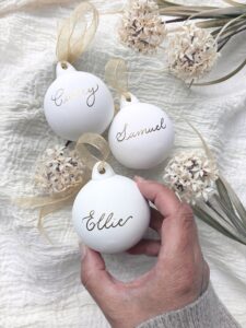 3 Christmas baubles with names on in gold ink